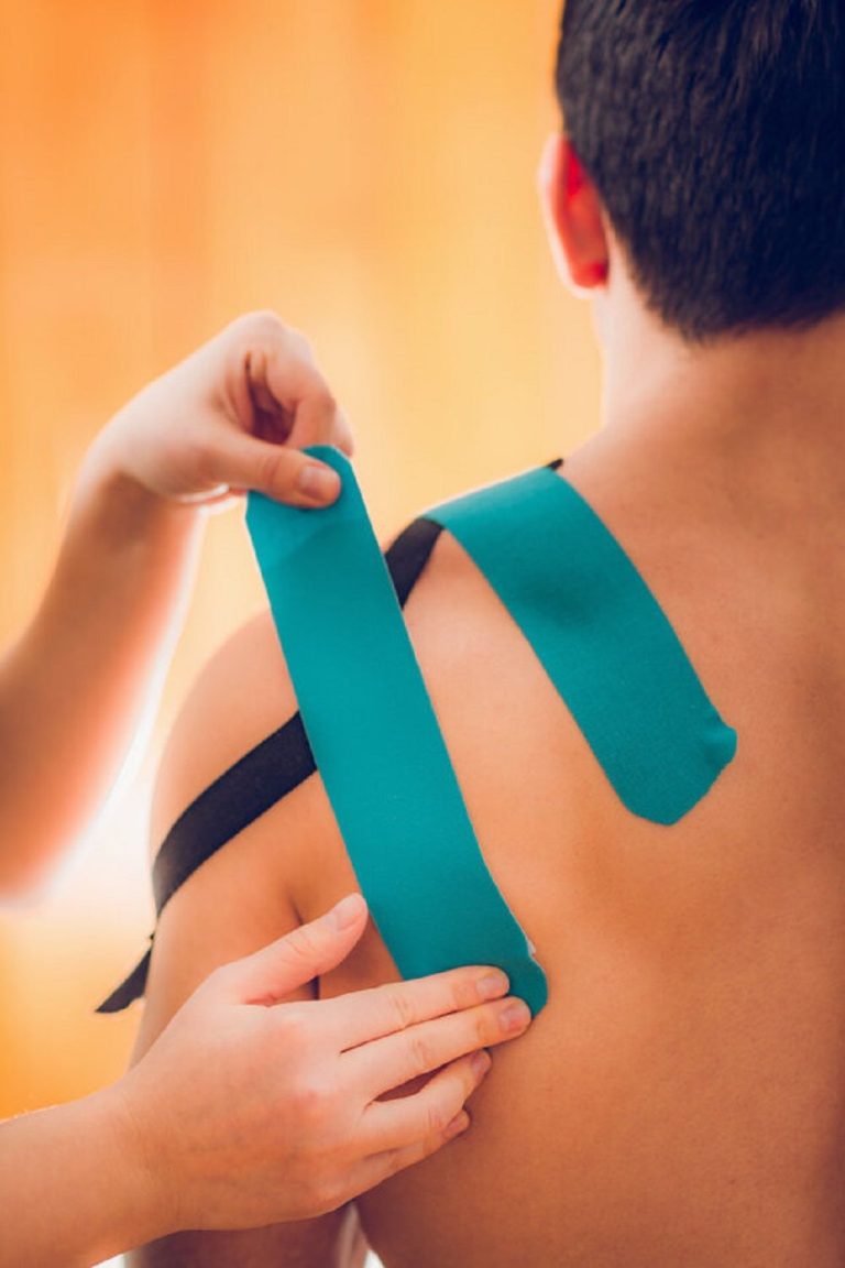 Shoulder treatment with kinesio tape